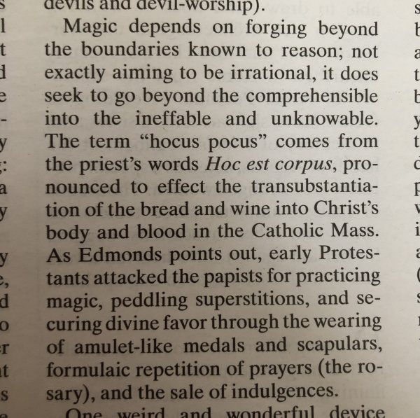 Clipping from the New York Review of Books explaining the origin of "hocus pocus"