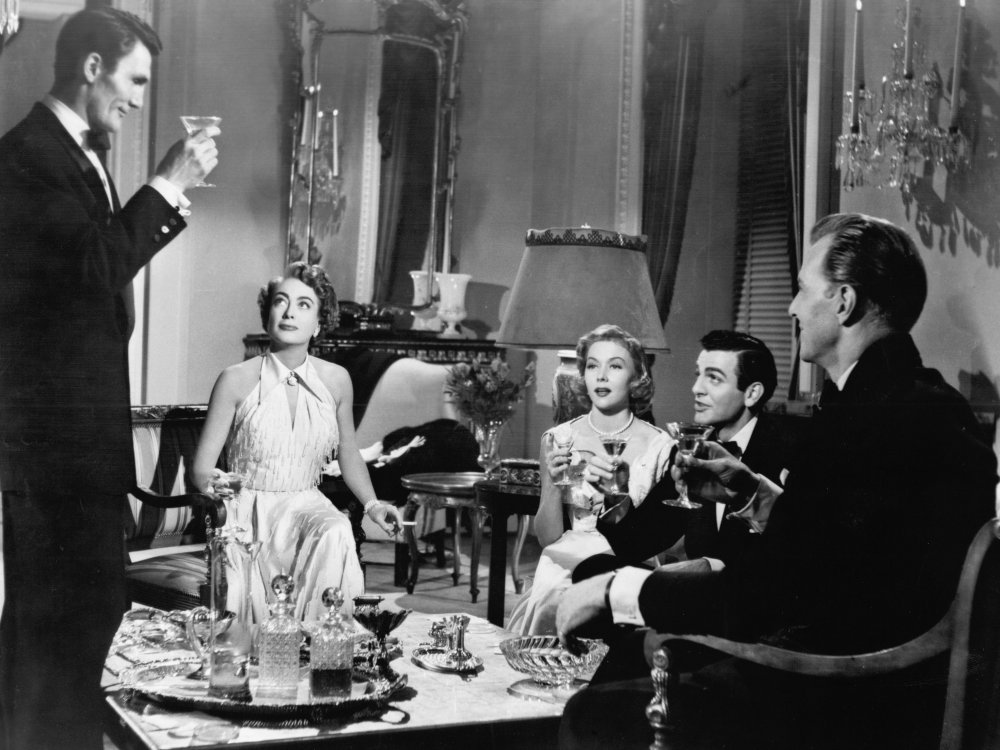 A still from the 1953 noir Sudden Fear, in which several characters have gathered for drinks before dinner.