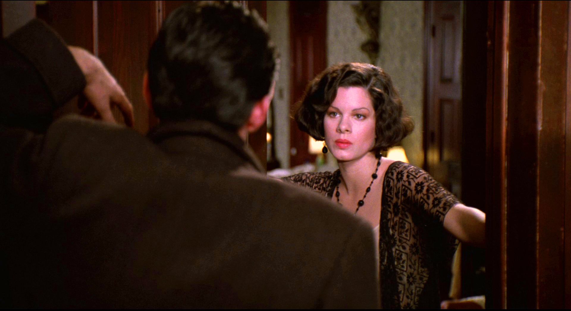 Gabriel Byrne and Marcia Gay Harden in the 1990 film Miller's Crossing