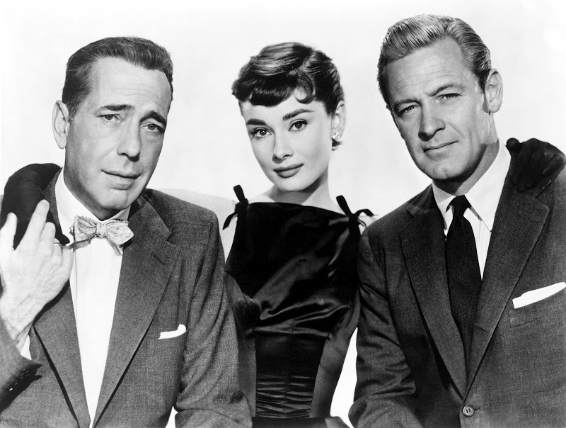 The cast of the 1954 Billy Wilder film Sabrina: Humphrey Bogart, Audrey Hepburn, and William Holden