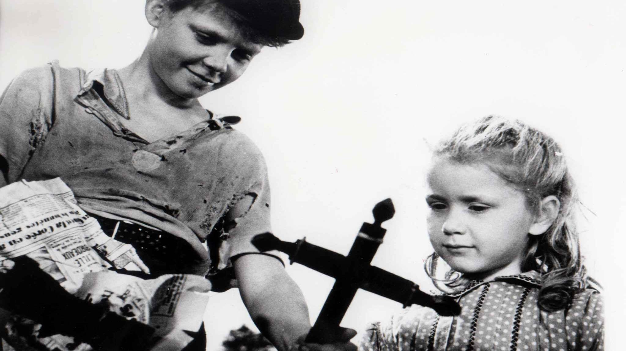 Michel and Brigitte discover a cross to take for their cemetery in the 1952 film Forbidden Games