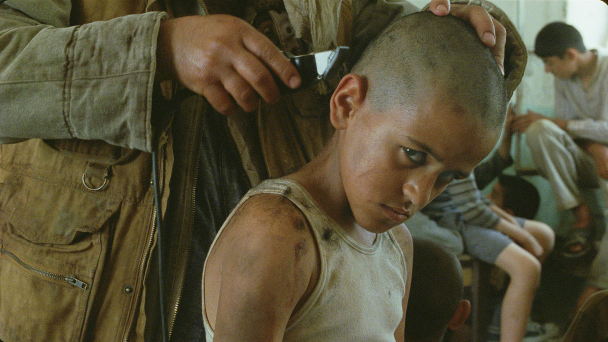 Still from the 2010 Denis Villeneuve film Incendies in which the son is about to begin a reign of terror that will bring into being two children