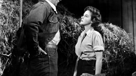 Robert Mitchum and Susan Hayward face off in a scene from "The Lusty Men" (1952)