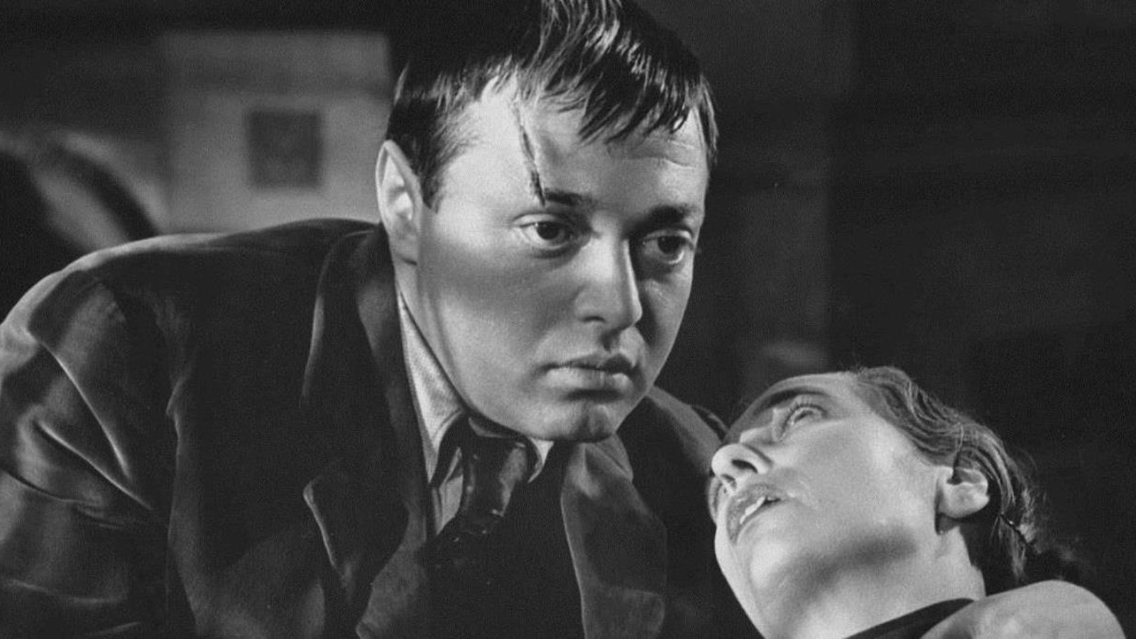 Peter Lorre's character holds his recently collapsed accomplice in The Man Who Knew Too Much (1934)