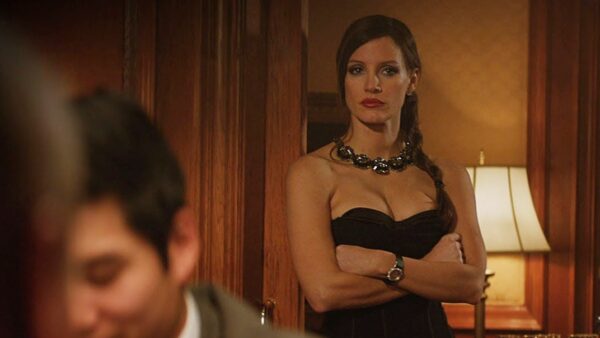 Jessica Chastain, showing cleavage, in a still from the film "Molly's Game"