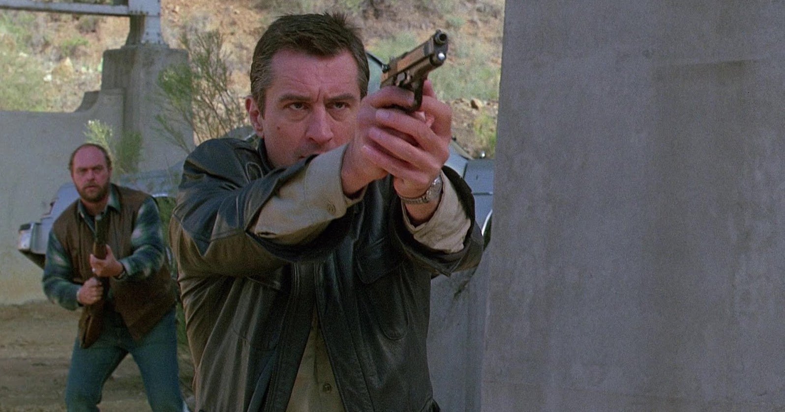 Jack and another character in Midnight Run, brandishing weapons