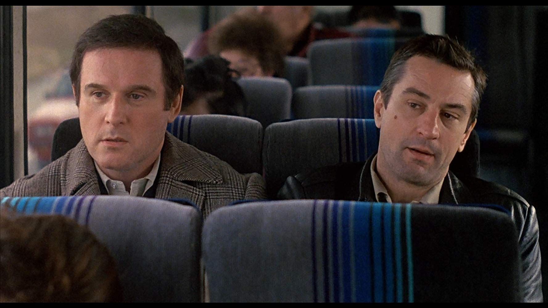 Still from 1988 film "Midnight Run" in a scene where Jack and The Duke are taking the bus