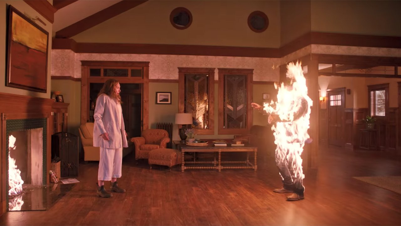 Still from "Hereditary" in which Steve is engulfed in flame after Annie's thrown Charlie's possessed sketchbook into the fire.