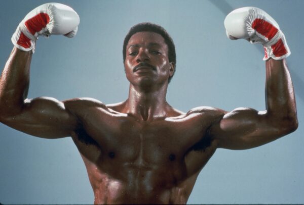 Apollo Creed flexing his muscles in the 1985 American Cold War propaganda film "Rocky IV"