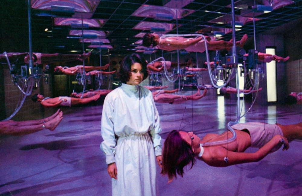 Dr. Wheeler (Genevieve Bujold) at the Jefferson Institute, where bodies are suspended both literally and biologically, until their organs are ready to be sold to the highest bidder, in the 1978 film "Coma"
