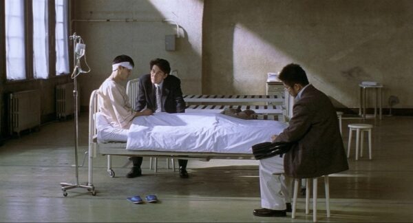 Detective Takabe interrogating an uncomprehending man who had murdered his wife, from the 1997 Kiyoshi Kurasawa film "Cure"