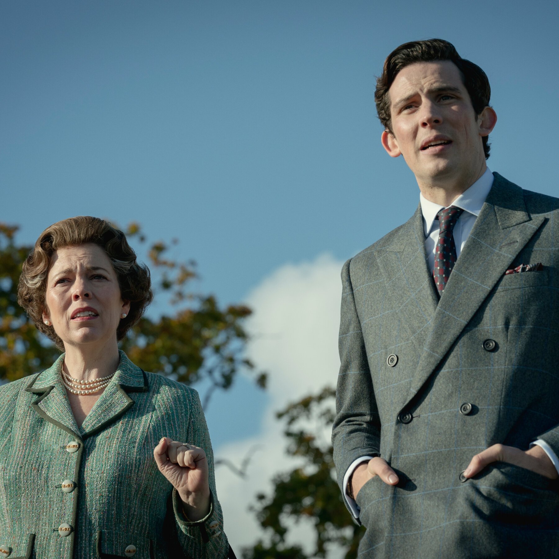 Still from season 4 of The Crown, with the Queen and Charles outdoors