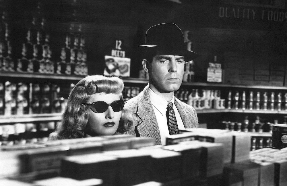 Still from a scene in the famous 1944 film noir Double Indemnity, with Barbara Stanwyck and Fred MacMurray