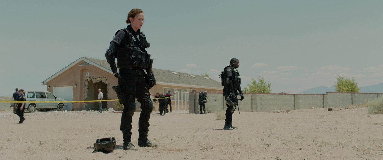Still of the aftermath of an FBI raid, from the 2015 Denis Villeneuve film Sicario, starring Emily Blunt, Daniel Kaluuya, Benicio Del Toro, and Josh Brolin.